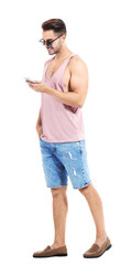 Young handsome man with mobile phone against white background