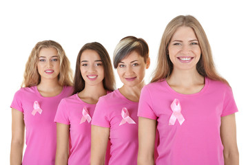 Beautiful women wearing t-shirts with pink ribbons on white background