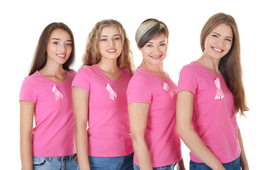 Beautiful women wearing t-shirts with pink ribbons on white background