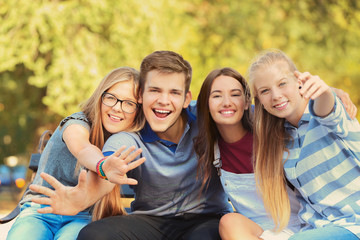 Fototapeta premium Happy teenagers posing on city street