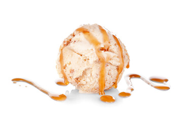 Scoop of ice cream with caramel topping, isolated on white