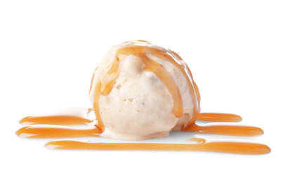 Scoop of ice cream with caramel topping, isolated on white