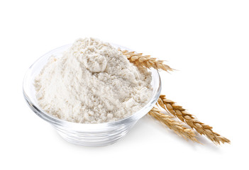 Bowl with flour on white background