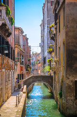 Naklejka na ściany i meble Traditional narrow canal with gondolas in Venice, Italy