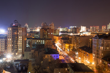 Fototapeta na wymiar Night panoramic aerial winter cityscape view of Voronezh city, houses, night lights