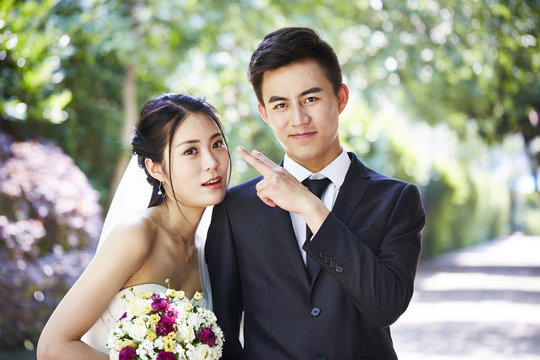 loving asian newly-wed couple