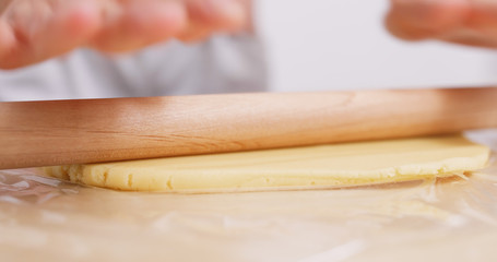 Rolling the dough making cookies at home