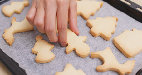Finishing cookies on tray