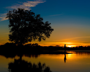 man fishing sunrise