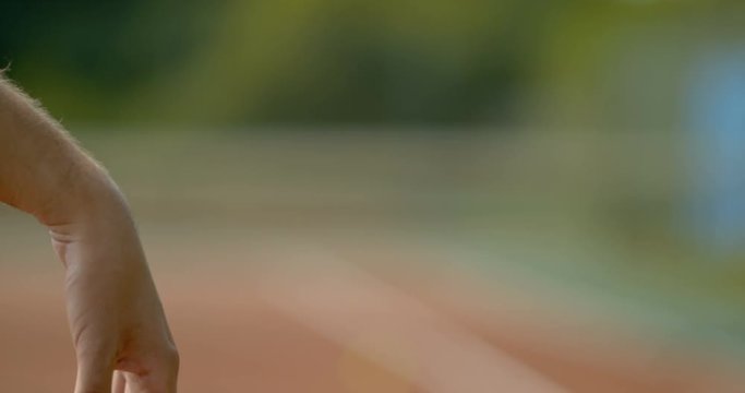  Close up in super slow motion, hand of tennis player bouncing the ball