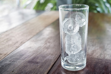 ice tube in glass on table