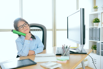 beautiful little business girl holding big pen