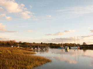 harbour pier dock wooden structure water outside boats lake river day