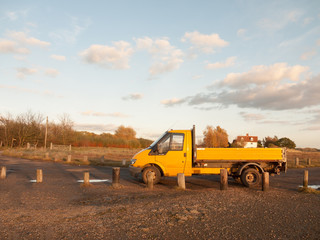 yellow outside environment van parked on gravel ranger