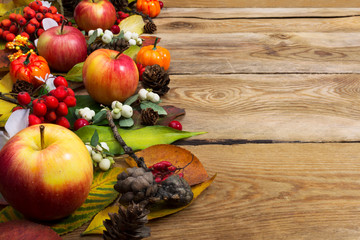 Thanksgiving greeting with ripe apples and white berry, copy space
