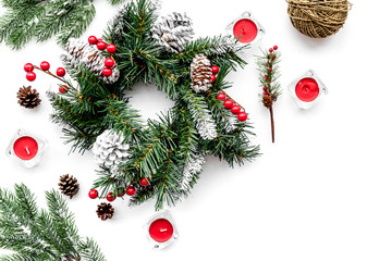 Make christmas wreath. Spruce branches, cones, threads, sciccors on white background top view copyspace