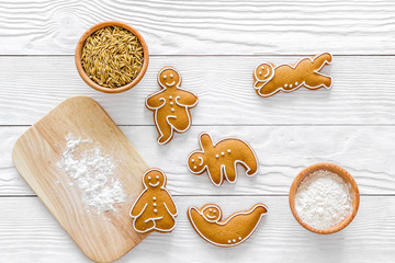 Make gluten free healthy food. Yoga asanas cookies near desk, flour and wheat on white background top view copyspace