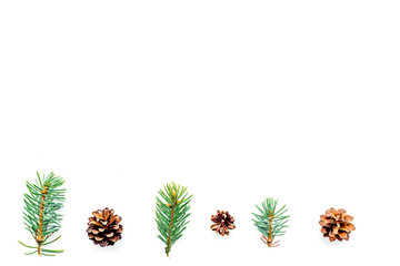 New year symbols pattern. Spruce branches and cones on white background top view copyspace