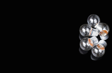 Light bulbs on black background