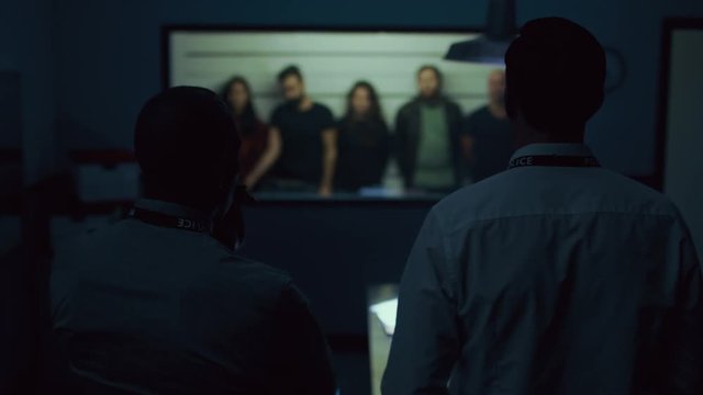  Detectives discussing line up of suspicious characters at police station