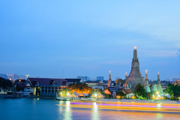 Arun temple famous tourist attraction in twilight time with light trails.Bangkok Thailand.