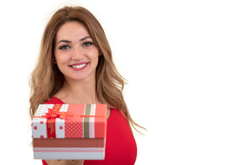Portrait of casual young happy smiling woman hold red gift box. Isolated studio background female model.