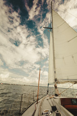 Yachting on sail boat during sunny weather