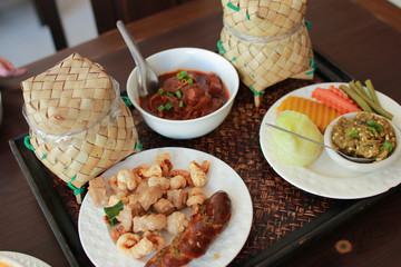 Northern's foods of Thailand SAI AUA (NOTRHERN THAI SPICY SAUSAGE), NAM PRIK NUM (NORTHERN THAI GREEN CHILLI DIP) and PORK SOUP (Kao Soi Moo). selective focus and with a very shallow depth of field