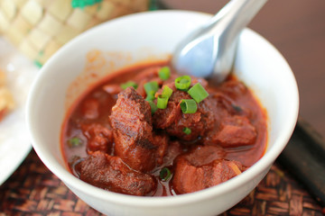 Thailand traditional favorite food or PORK SOUP (Kao Soi Moo). selective focus and with a very shallow depth of field