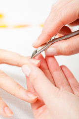 Preparing nails before manicure, cutting cuticles