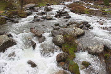 Glacier water flowing through the stone