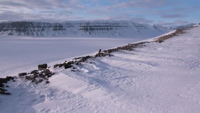 Amazing ice desert landscape in Arctic. Silence quiet of wilderness North Pole Way to Pyramid on Spitsbergen Svalbard in Norway.