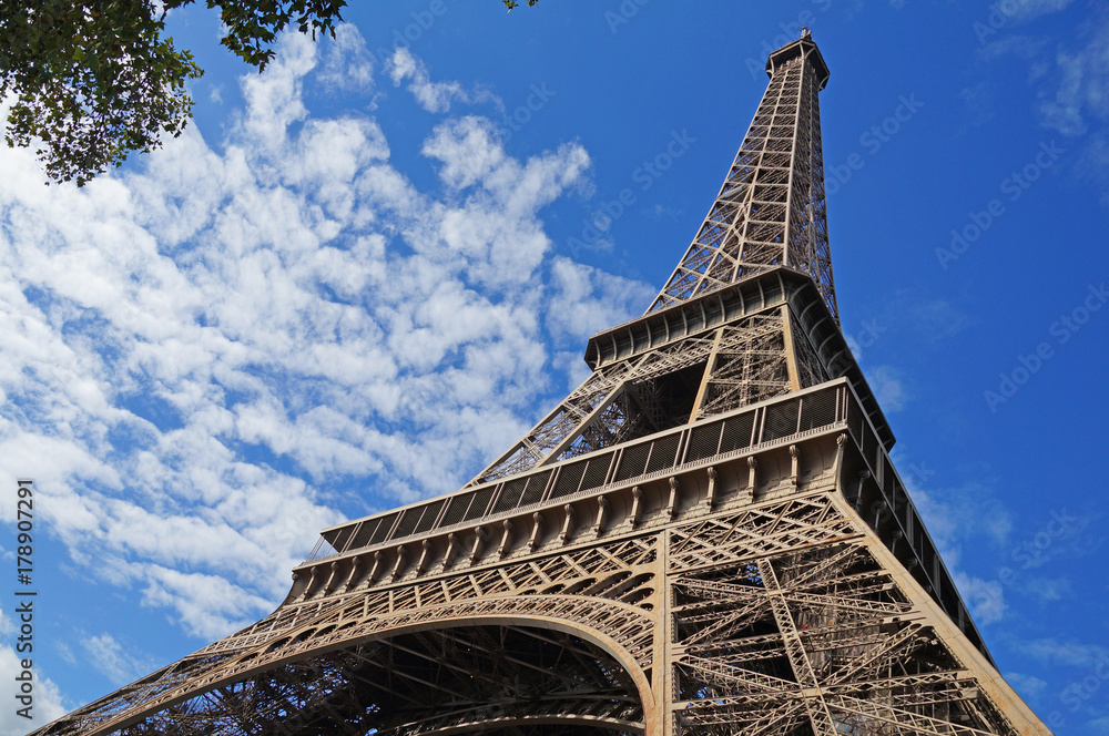 Wall mural sunny paris. eiffel tower on a sunny day.