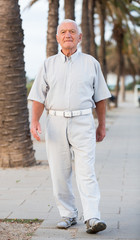Obraz premium man walking in the park at weekend