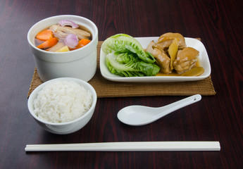 Chicken and herb soup in pot, Chinese food style.