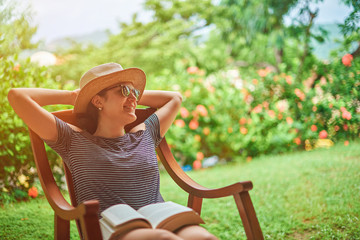 Happy comfortable young woman in terrace