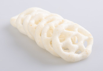 Junk food, potato ring on a background