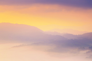 Fototapeta na wymiar Sunshine and clouds on the morning mist At Phu Lang Ka, Phayao, Thailand