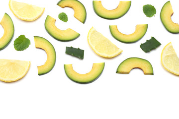 healthy food. sliced avocado isolated on white background. top view