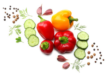mix of sliced cucumber, garlic, sweet bell pepper and parsley isolated on white background. top view