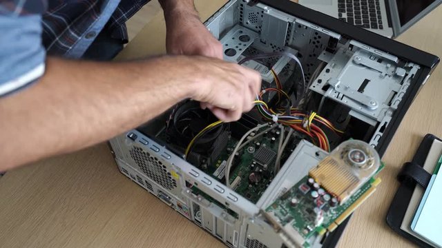 Technician repairing computer hardware
