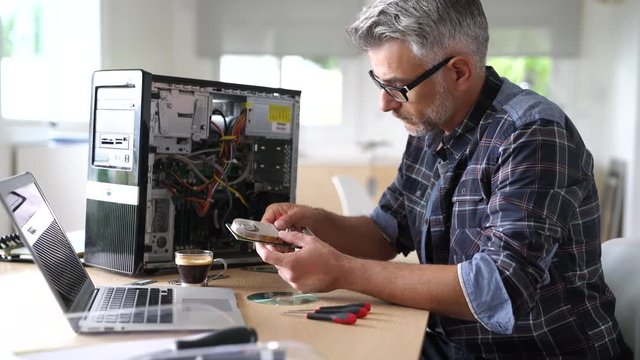 Technician repairing computer hardware