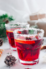 Non-alcoholic mulled wine with lemon and cinnamon in glass glasses, selective focus