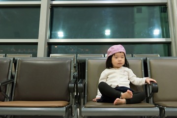 Asian child at airport terminal