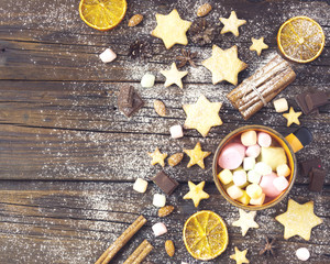 Christmas gingerbread cookies stars on a wooden table and coffe, selective focus