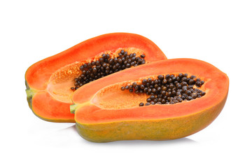 half of ripe papaya fruit with seeds isolated on white background