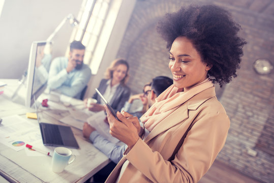 Portrait of confident young businesswoman using digital tablet