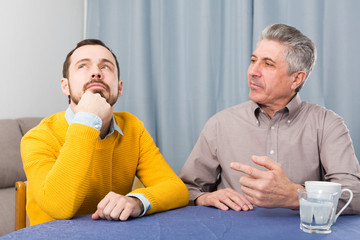 Mature father and son serious talk