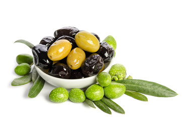 Black and green  olives  mixed in the  porcelain bowl isolated on white background
