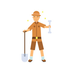Archaeologist standing with shovel and big bone in hands